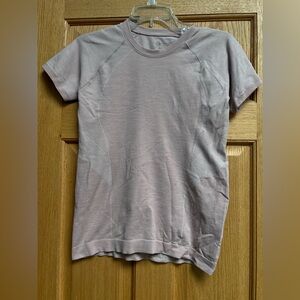Sweaty Betty London- Color:Light Purple Size:Med Short-sleeved athletic t-shirt.